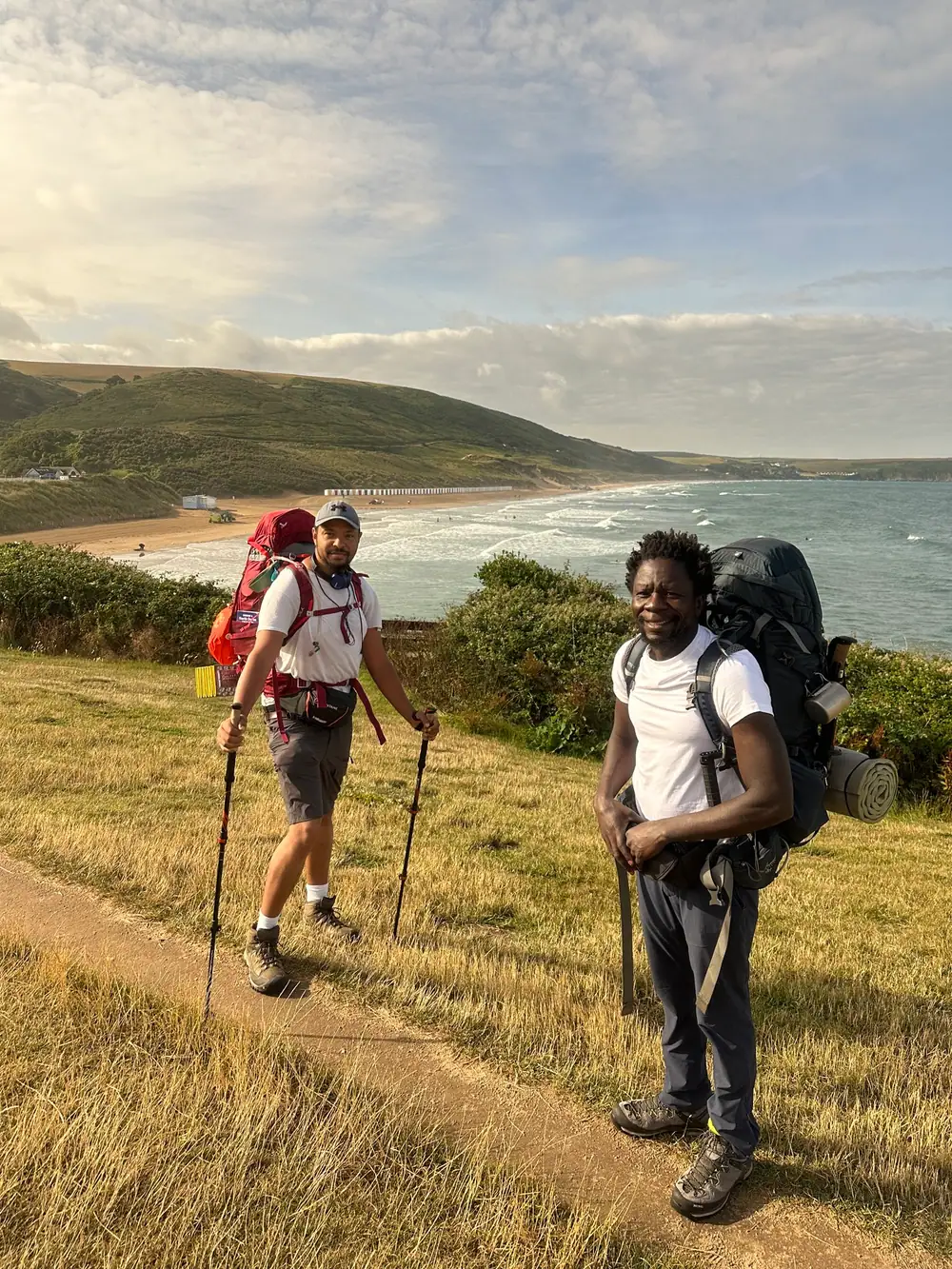 Sean Lewis and Andrew Okello on the South West Coast Path in Woolacombe
